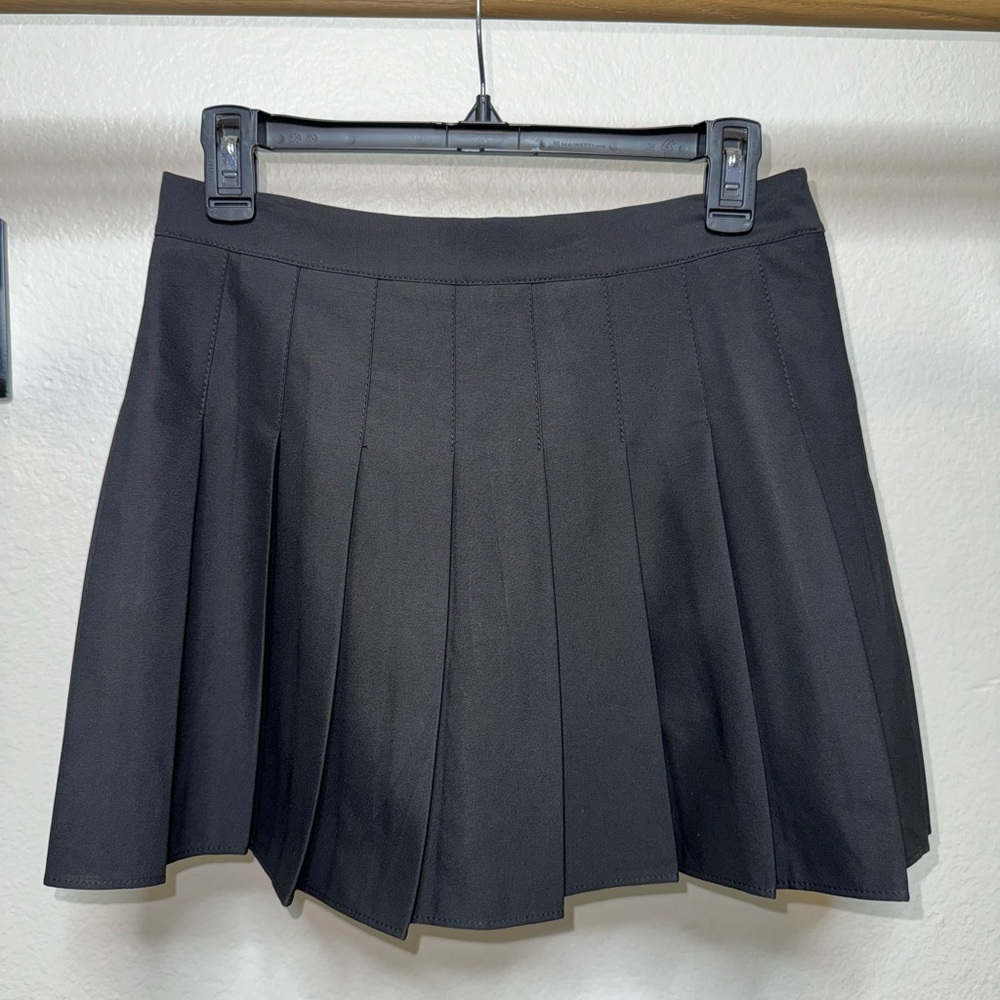 Black pleated high waisted skirt with built in shorts